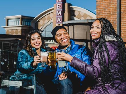 People sip beverages on the patio at Southlands