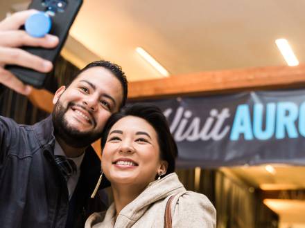 A couple takes a selfie at Aurora's 2019 Annual Meeting.