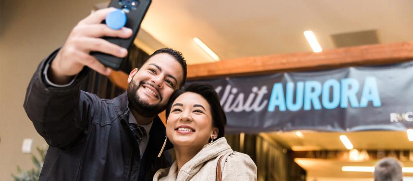 A couple takes a selfie at Aurora's 2019 Annual Meeting.
