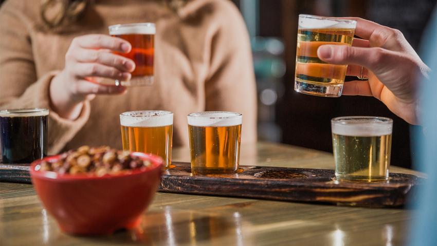 Two friends share a flight of beer at Cheluna Brewing Company in Aurora CO