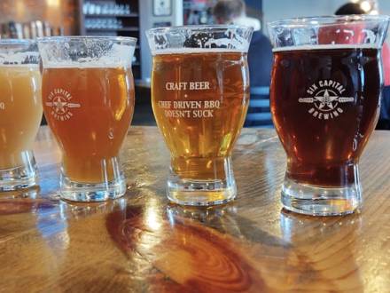 A flight of colorful beers from Six Capital Brewing & BBQ located in Aurora Colorado