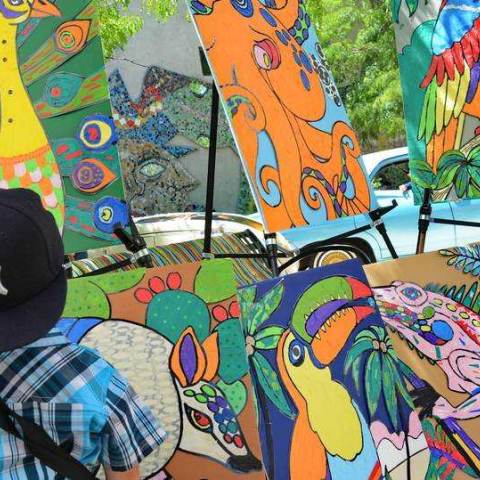 Child viewing art in Aurora