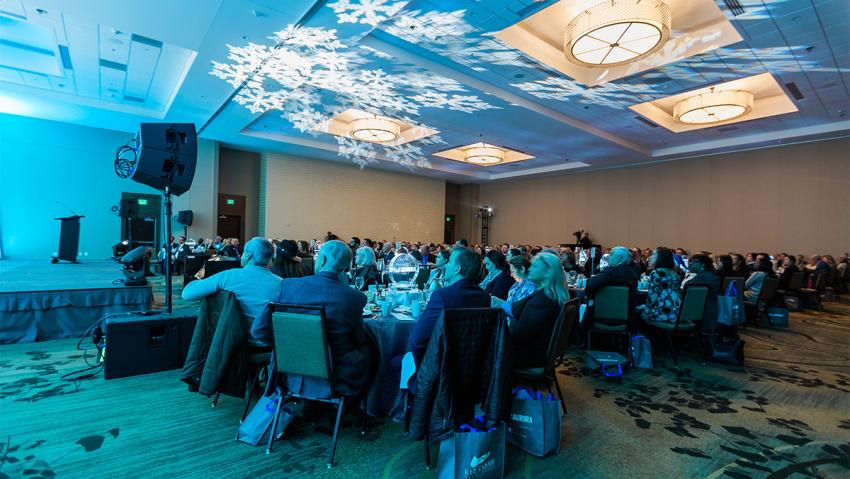People watch performers at Annual Meeting