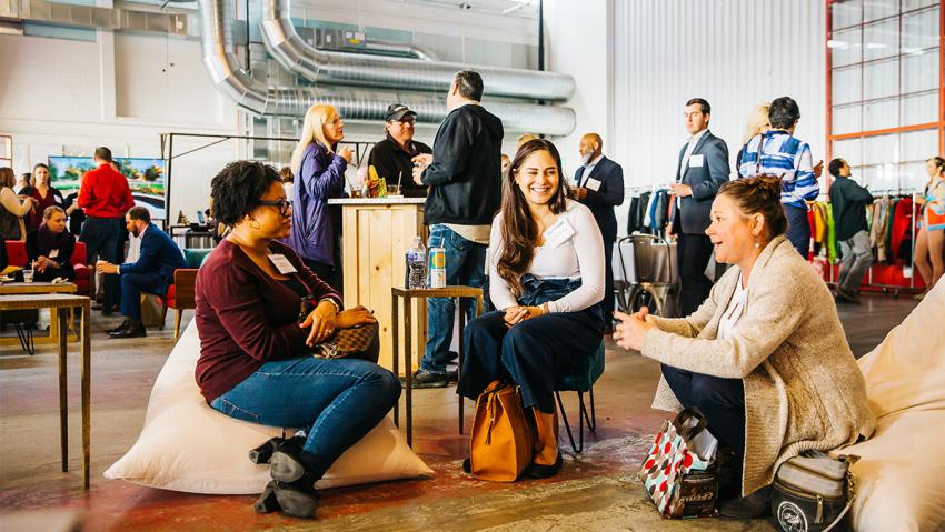 Women gather at The Hangar at Stanley Marketplace in Aurora CO