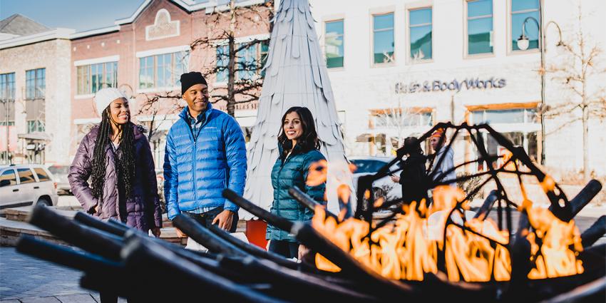 People enjoying the outdoor firepit at Southlands in Aurora, Colorado