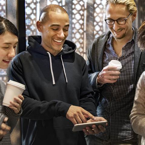 People looking at the Visit Aurora Savings Pass app on their phone