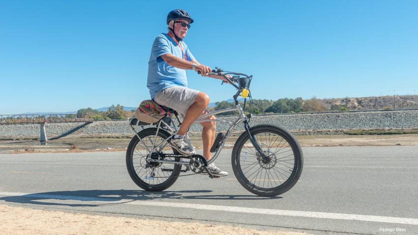 Man riding pedego bikes.