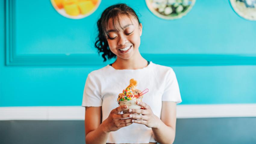 A young girl holds an interesting ice cream at Snowl in Aurora CO