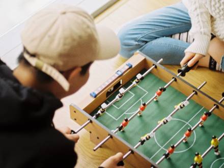 Two people play games inside